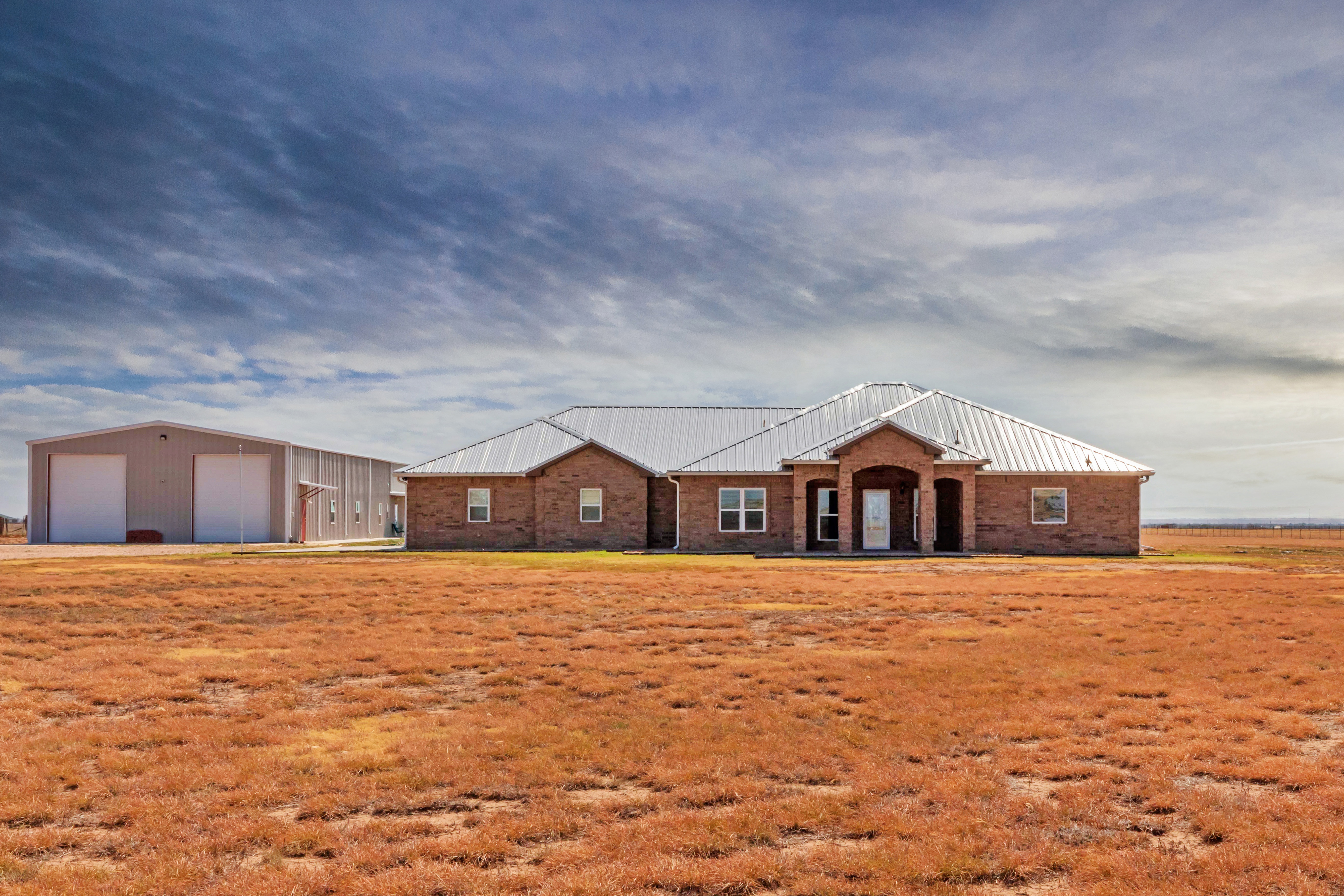 Explore 21561 Arnot Road: Country Home, Shop, Barndominium & 16.66 Acres in Canyon, Texas